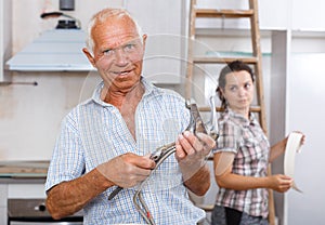 Man preparing faucet for installation