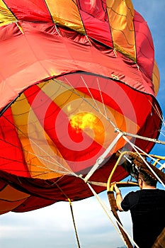 Man preparing hot air baloon for fly #4