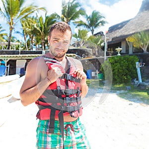 Man preparing with life vest to go on the sea