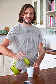 Man preparing morning coffee