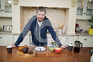 Man preparing muffins in the kitchen