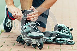 Man preparing for roller blading,