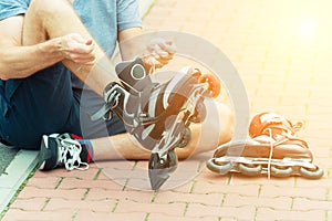 Man preparing for roller blading,