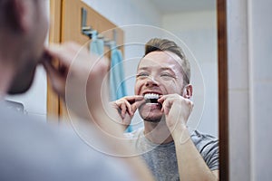 Man preparing silicon tray for teeth whitening