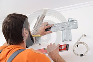 Man preparing to install new air conditioner. Modern air conditioner during the installation process