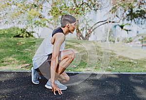 Man preparing to run in park