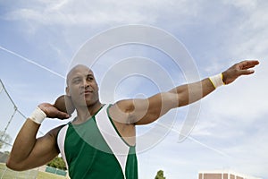 Man Preparing To Toss Shot Put