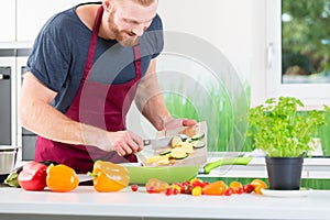 Man preparing food for cooking in kitchen