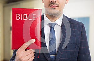 Man presenting bible