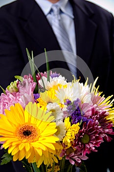 Man presenting flowers