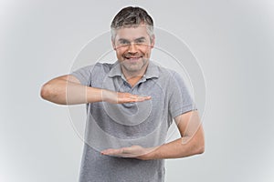 Man presenting your product isolated over white background.