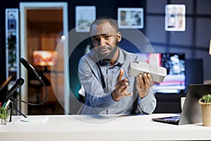 Man presents sponsored portable speaker photo