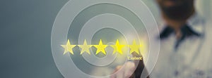 Man press on five star excellent review for quality service or best positive business rate by customer evaluation in performance e