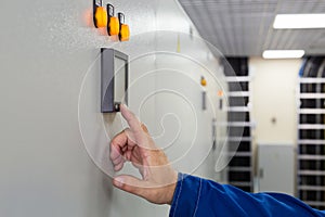 A man presses a button control