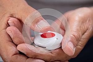 Man Pressing Alarm Button