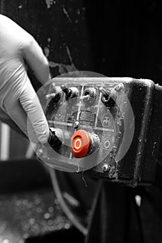 Man pressing button on an industrial machine