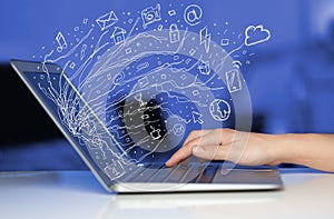 Man pressing notebook laptop computer with doodle icon cloud symbols