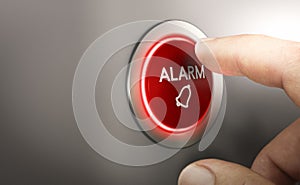 Man pressing a red security alarm button