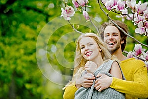 Man and pretty girl or cute woman enjoying pink magnolia