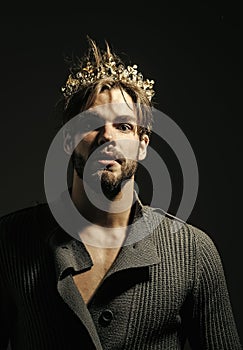 Man or prince in crown on grey background