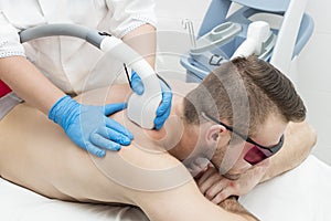 Man on the procedure of laser hair removal