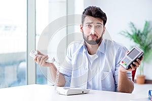 The man processing credit card transaction with pos terminal