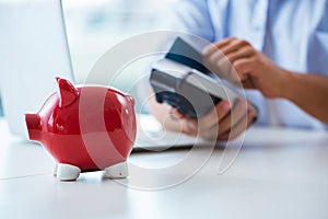 The man processing credit card transaction with pos terminal