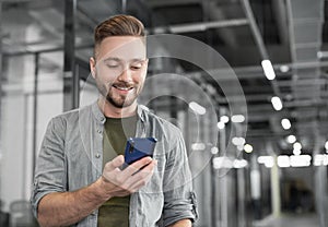 Man professional using smartphone in office. Businessman working, texting on mobile phone.