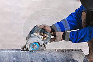 Man professional worker cutting tile