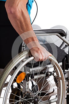 Man propelling wheelchair