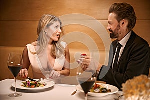 Man proposes to his companion over romantic dinner in restaurant