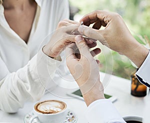 Man proposing girlfriend with diamond ring
