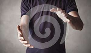 Man with protect gesture