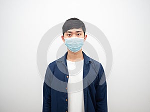 Man with protect mask standing and looking at camera on isolated white