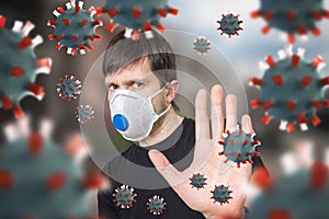 Man is protecting with FFP3 respirator face mask. Many viruses around.