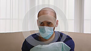 Man with protection mask having a panic attack