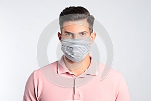 Man in protective face mask on white background