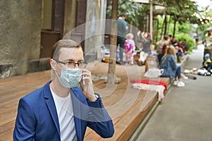 Man in protective mask at city. Male person portrait