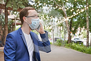 Man in protective mask at city. Male person portrait