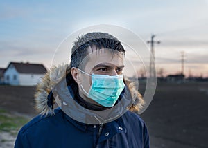 Man with protective mask walking outside