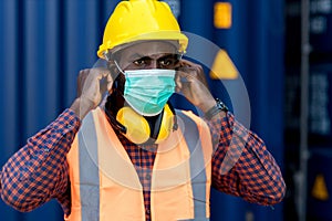 Man with protective mask before work. Man putting on medical face mask. Man wearing an anti virus protection mask to prevent other