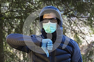 Man in protective sterile medical mask on hisr face
