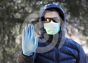 Man in protective sterile medical mask on hisr face