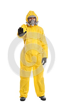 Man in protective suit making stop gesture on white background. Virus research