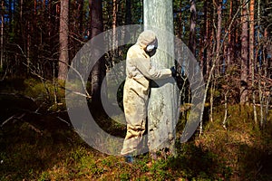 Man in protective suit, mask in forest