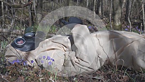 Man in protective suit, mask in forest