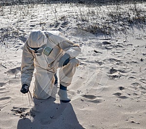 man in protective suit, mask in sea beach