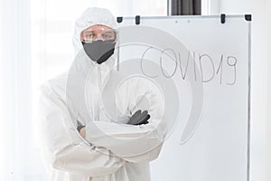 Man in protective suit, medical mask, goggles. Isolated in studio. antigas mask with glasses at white background. Man