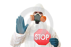Man in protective suit with a sign STOP