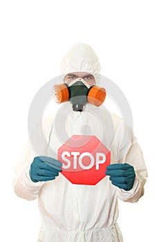 Man in protective suit with a sign STOP